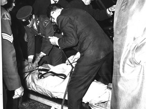 Pierre Laporte's body is taken from the trunk of 1968 Chevrolet on Oct. 18, 1970. (Montreal Star)