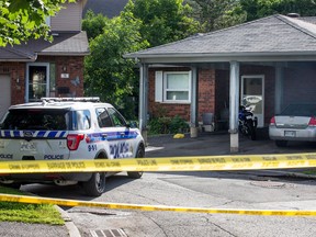 Ottawa police remain outside 76 Meaghan Pte, the scene of a shooting on Sunday night.