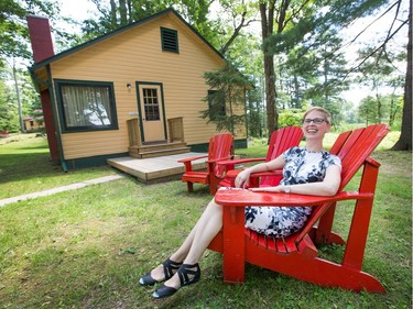 Fiona McKean in front of one of the cottages as the Opinicon Resort is up and running after a major renovation and restoration over the last two and half years.
