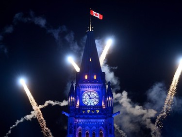 Fireworks light up behind the Peace Tower during the evening ceremonies of Canada's 150th anniversary of Confederation, in Ottawa on Saturday, July 1, 2017.