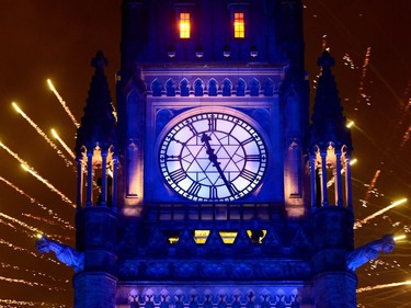 Fireworks light up behind the Peace Tower during the evening ceremonies of Canada's 150th anniversary of Confederation, in Ottawa on Saturday, July 1, 2017.