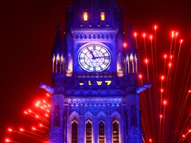 Fireworks light up behind the Peace Tower during the evening ceremonies of Canada's 150th anniversary of Confederation in Ottawa on Saturday.