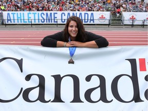 Gabrielle Rains of Edmonton has reason to smile after breaking her own Canadian championship record in discus with a throw of 51.60 metres at the Terry Fox Athletic Facility on Friday.  Tony Caldwell/Postmedia