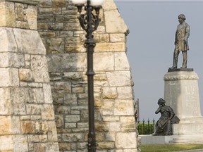 The statute of Thomas D'Arcy McGee behind Parliament Hill.