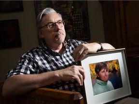 Carleton professor Paul Adams, seen here with a portrait of his wife Suzanne Szukits, a Canadian diplomat, who died from cancer last September at the age of 56, has written a moving first-person essay about the challenges he and his wife faced when it came to her palliative care.