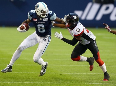 Jeff Fuller of the Toronto Argos gets around Corey Tindal of the Ottawa Redblacks at BMO field in Toronto during CFL action in Toronto, Ont. on Monday July 24, 2017.