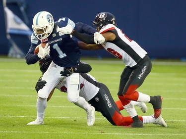 Johnny Sears Jr of the Toronto Argos gets through traffic around the Ottawa Redblacks at BMO field in Toronto during CFL action in Toronto, Ont. on Monday July 24, 2017.