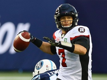 Trevor Harris of the Ottawa Redblacks looks to pass against the Toronto Argos at BMO field in Toronto during CFL action in Toronto, Ont. on Monday July 24, 2017.