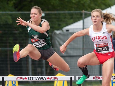 Heptathletes Lexi Kundlacz (L) and Olivia Crewe compete in the 100m hurdles as the Canadian Track and Field Championships get underway at the Terry Fox Athletic Facility.