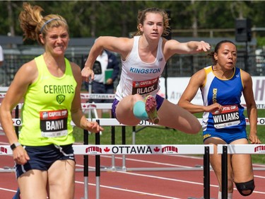 Heptathletes Michaela Banyi (L), Amanda Black (C), and Kaylyn Williams (R) compete in the 100m hurdles as the Canadian Track and Field Championships get underway at the Terry Fox Athletic Facility.