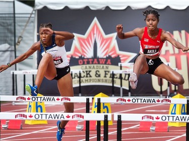 Heptathletes Amani Briggs (L) and Anya Akili compete in the 100m hurdles as the Canadian Track and Field Championships get underway at the Terry Fox Athletic Facility. Anya would land awkwardly on her leg and wouldn't finish the race.