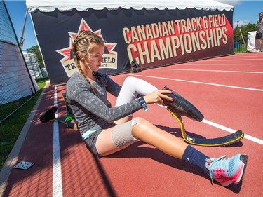 Para-athlete Madison Wilson-Walker, 20, puts on her blades in place of her everyday prothetic legs as she begins training for the 100 and 200 metre sprints coming up on Tuesday and Wednesday as the Canadian Track and Field Championships get underway at the Terry Fox Athletic Facility.