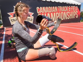 Para-athlete Madison Wilson-Walker, 20, puts on her blades in place of her everyday prothetic legs as she begins training for the 100 and 200 metre sprints coming up on Tuesday and Wednesday as the Canadian Track & Field Championships get underway at the Terry Fox Athletic Facility.