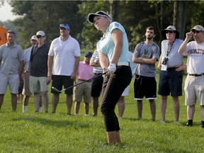 Canada's Brooke Henderson hits out of the rough onto the 11th green during the first round of the U.S. Women's Open Golf tournament Thursday, July 13, 2017, in Bedminster, N.J.