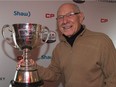 Former Ottawa Rough Rider quarterback Russ Jackson poses with the Grey Cup during a ceremony in 2016.