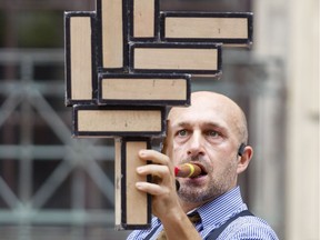 Mat Ricardo, the Gentleman Juggler, performs on Sparks St. as part of the 2017 Ottawa Buskerfest Friday, August 4, 2017