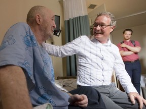 Keith Watt, a patient at the Diane Morrison Hospice, left, chats with Dr. Jeff Turnbull while he made his rounds with Ottawa Inner City Health Thursday, August 3, 2017.