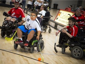 The Canadian Electric Wheelchair Hockey Association (CEWHA) 2017 National's took place at Carleton University Raven's Nest Saturday August 5, 2017. #8 Malaky Lamberson was one of the top goal scorers for the Ottawa Black Aces during the exhibition game against Team Canada.   Ashley Fraser/Postmedia
Ashley Fraser, Postmedia