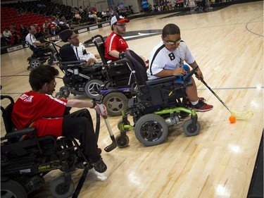 Malaky Lamberson, No. 8, of the Ottawa Black Aces puts some moves on Team Canada defenders at the Canadian Electric Wheelchair Hockey Association (CEWHA) held its 2017 Nationals at Carleton University's Raven's Nest Saturday August 5, 2017.Ashley Fraser/Postmedia
Ashley Fraser, Postmedia