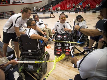 The Ottawa Black Aces huddle up before their exhibition game against Team Canada at the Canadian Electric Wheelchair Hockey Association (CEWHA) 2017 Nationals at Carleton University's Raven's Nest Saturday August 5, 2017. Ashley Fraser/Postmedia
Ashley Fraser, Postmedia