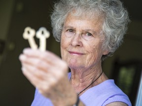 Joke Koningstein is photographed in her home with a set of keys to a safety deposit box, the contents of which she says her neighbourhood bank seems to have lost.