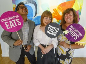 From left, Dan Hwang, chair of Westboro Village BIA, MaryAnne Petrella, manager at Canopy and CIEL and Mary Thorne, executive director of the Westboro Village BIA ham it up during the official launch to the 2017 Westboro FUSE at Wallspace Gallery Thursday.