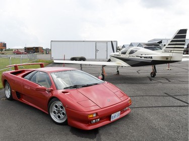 A Lamborghini is on display next to an plane at Race the Runway.