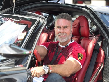 Olivier Benloulou sits in his Pagani Huayra.
