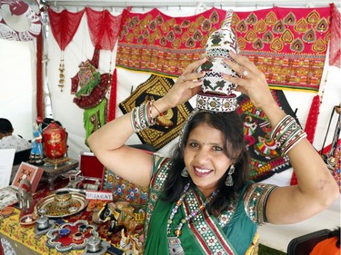 Alpa Shah poses with her crafts from the Gujarat state of India at the South Asian Festival at City Hall in Ottawa on Sunday, August 13, 2017.