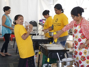 Preparing food at the South Asian Festival at City Hall in Ottawa on Sunday, August 13, 2017.