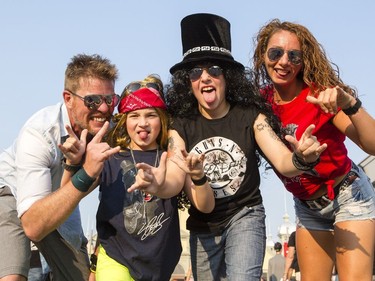 Tom Fischer as Axel Rose, second from left, and Ben Fischer as Slash, second from right, make the most of their concert with their parents, Mike and Amy Fischer.
127344
Darren Brown, Postmedia