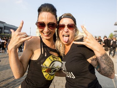 Sisters, Melanie, left, and Mychelle Periard ham it up for the camera before the Guns N Roses concert at TD Place Monday, August 21, 2017.  (Darren Brown/Postmedia) Neg: 127344

127344
Darren Brown, Postmedia