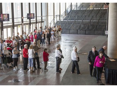 People line up to sign a book of condolences during a celebration of life service for former Ottawa Senators general manager and coach, Bryan Murray, at the Canadian Tire Centre Thursday, August 24, 2017.