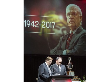 Ottawa Senators' Randy Lee, left, and GM Pierre Dorion speak during a celebration of life service for former Ottawa Senators general manager and coach, Bryan Murray, at the Canadian Tire Centre Thursday, August 24, 2017