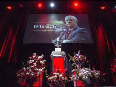 The Jack Adams Award, which Bryan Murray won in 1984, sits among flowers during a celebration of life service for former Ottawa Senators general manager and coach, Bryan Murray, at the Canadian Tire Centre Thursday, August 24, 2017