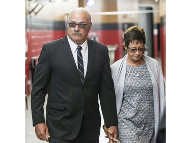 Former Ottawa Senators head coach, Paul MacLean, left, arrives with his wife, Sharon, for a celebration of life service for former Ottawa Senators general manager and coach, Bryan Murray, at the Canadian Tire Centre Thursday, August 24, 2017.