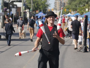 Jonny Nicklekicker juggles at the Westboro Fuse street festival in Ottawa on Saturday, August 26, 2017.