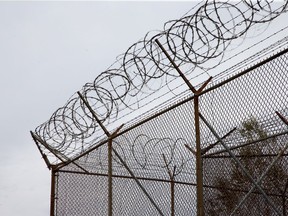 Barbed wire tops the fences of the Ottawa Carleton Detention Centre on Innes Road.