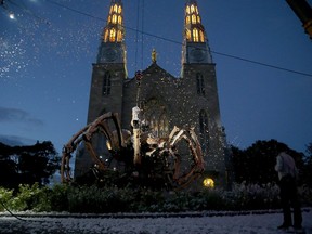 Kumo — the massive mechanical spider from La Machine — 'awoke' atop of Notre Dame Cathedral in Ottawa last Thursday.