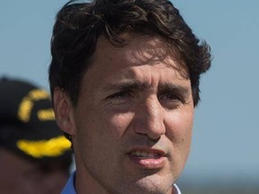 Prime Minister Justin Trudeau speaks during a news conference in Williams Lake, B.C., after viewing areas affected by wildfire from a Canadian Forces helicopter, on Monday, July 31, 2017. Trudeau says he &ampquot;regrets&ampquot; comments he made about Sen. Patrick Brazeau in a recent interview with Rolling Stone magazine.THE CANADIAN PRESS/Darryl Dyck