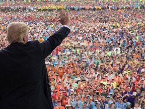 FILE - In this July 24, 2017 file photo, President Donald Trump waves to the crowd after speaking at the 2017 National Scout Jamboree in Glen Jean, W.Va. The Boy Scouts are denying a claim by President Donald Trump that the head of the youth organization called the president to praise his politically aggressive speech to the Scouts‚Äô national jamboree. (AP Photo/Carolyn Kaster, File)