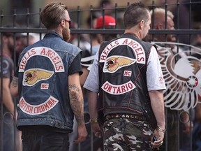 Members of the Hells Angels from British Columbia and Ontario enter the Hells Angels Nomads compound during the group&#039;s Canada Run event in Carlsbad Springs, Ont., near Ottawa, on Saturday, July 23, 2016. The management of a Quebec agricultural fair is admitting it made a mistake in allowing a group associated with the Hells Angels to sell products at the site.THE CANADIAN PRESS/Justin Tang