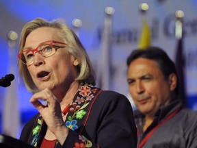 Minister of Indigenous and Northern Affairs, Carolyn Bennett speaks as AFN National Chief Perry Bellegarde looks on at the Assembly of First Nations annual general meeting in Regina, Sask., Tuesday July 25, 2017. Bennett says she&#039;s troubled by reports of Indigenous women in and around Saskatoon being coerced into tubal ligation procedures. THE CANADIAN PRESS/Mark Taylor