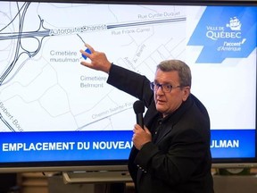 Quebec City mayor Regis Labeaume points at a map as he announces the establishment of a Muslim cemetery, in Quebec City on Friday, August 4, 2017. THE CANADIAN PRESS/Jacques Boissinot