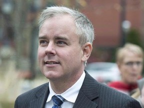 Dennis Oland heads from a bail hearing after being released from custody in Fredericton on Tuesday, Oct. 25, 2016. Prosecutors and lawyers for Oland will be back in New Brunswick court Tuesday for a hearing to set a date for a new second-degree murder trial, but it&#039;s expected they&#039;ll ask for a month-long delay. THE CANADIAN PRESS/Andrew Vaughan