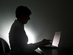 A woman types on her laptop in Miami in a Monday, Dec. 12, 2016, photo illustration. In the past month, Roxanne messaged more than two dozen Ontario women on Facebook to warn them that their photos had surfaced on the image-sharing site Anon-IB.It&#039;s something the Toronto resident has been doing on and off since she learned four years ago that her own photos had cropped up on the site â€” a place where users gather to share images, many of which are sexually explicit. THE CANADIAN PRESS/AP/Wilfre