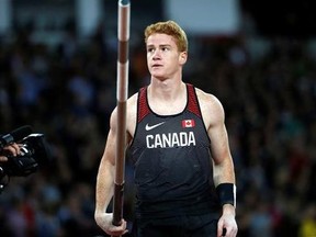 Canada's Shawn Barber holds a pole in the men&#039;s pole vault final during the World Athletics Championships in London Tuesday, Aug. 8, 2017.