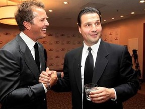 In this Monday, Oct. 15, 2012, Hockey greats Eddie Olczyk, right, and Mike Modano shake hands and visit before the U.S. Hockey Hall of Fame class of 2012 induction dinner in Dallas. Former NHL forward and coach Eddie Olczyk has been diagnosed with colon cancer, Tuesday, Aug. 8, 2017. Olczyk, who turns 51 on Aug. 16, had surgery last week, and Blackhawks team physician Dr. Michael Terry says he ‚Äúwill be undergoing further treatment in the coming weeks, including chemotherapy.