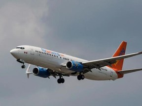 A Sunwing Boeing 737-800 passenger plane prepares to land at Pearson International Airport in Toronto on Wednesday, August 2, 2017. A national union representing thousands of flight attendants is using a recent court ruling to push the federal government to tighten airline passenger safety rules.A Federal Court of Appeal judge ruled last week that Transport Canada couldn&#039;t have reasonably concluded that passenger or crew safety wasn&#039;t compromised when it allowed Sunwing Airlines to increase the