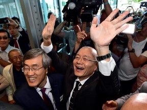 Pastor Hyeon Soo Lim waves to the congregation as he arrives at the Light Presbyterian Church in Mississauga, Ont., Sunday, August 13, 2017. Lim was released last week from prison in North Korea, where he had been serving a life sentence with hard labour for anti-state activities. THE CANADIAN PRESS/Frank Gunn